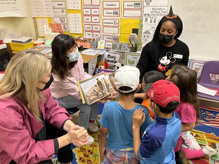Volunteers reading to kids at Magnolia Elementary