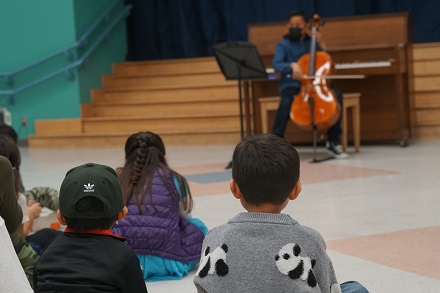 A boy playing the cello at Esperanza Elementary