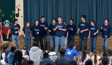 Medleys A Cappella singing to the kids after reading to them at Magnolia Elementary